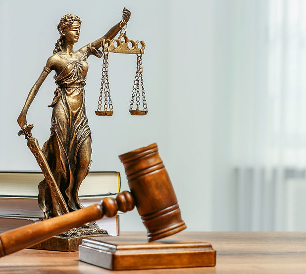 Figure of Lady Justice gavel and books on table indoors space for text_edited_edited.jpg