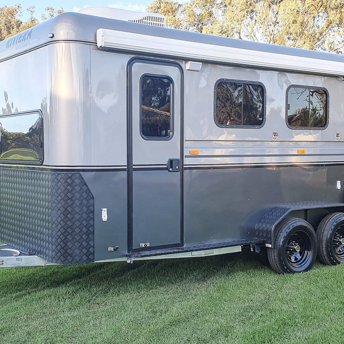 Front side view of the Riviera 2 Horse Angle Load Overnighter Deluxe horse float