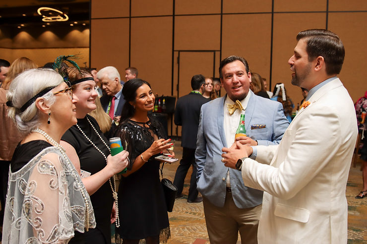 Anthony Dempsey, a top performing corporate magician, mingles with guests at a themed corporate gala.