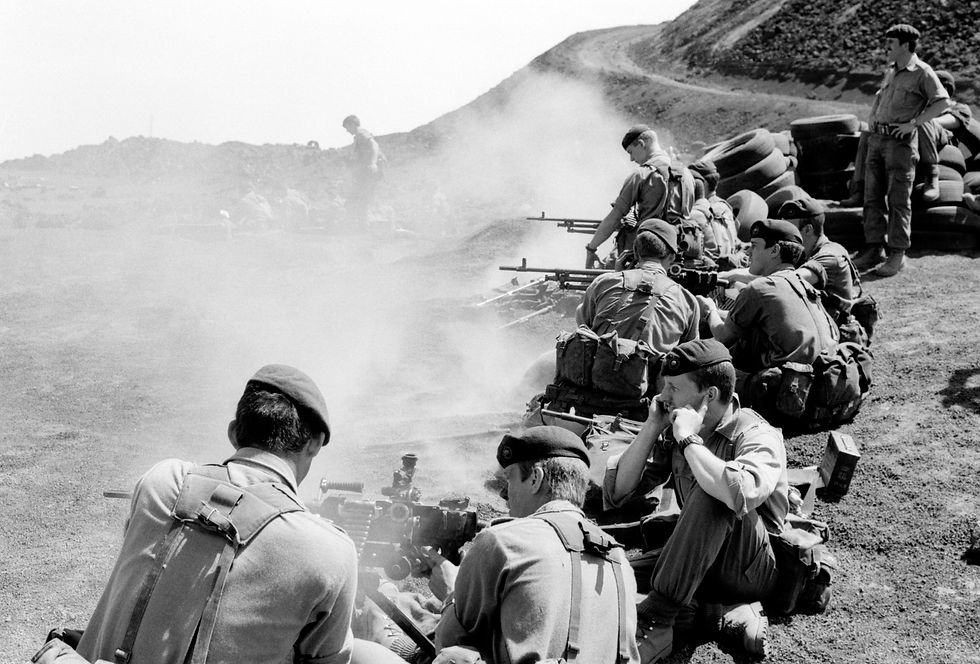 Royal Marines Commandos test fire their machine guns on Ascension Island prior to the Falklands Conflict in 1982 (Photos provided by Alamy)
