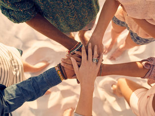 Women's hands at the center, one on top of the other