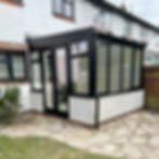 A black, uPVC conservatory fitted by Fox Home Improvements