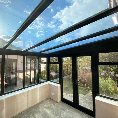 Internal view of a black uPVC conservatory fitted by Fox Windows & Doors
