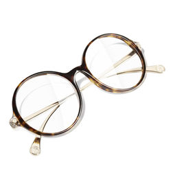 Lunettes optiques CHANEL rondes pour un look branché.