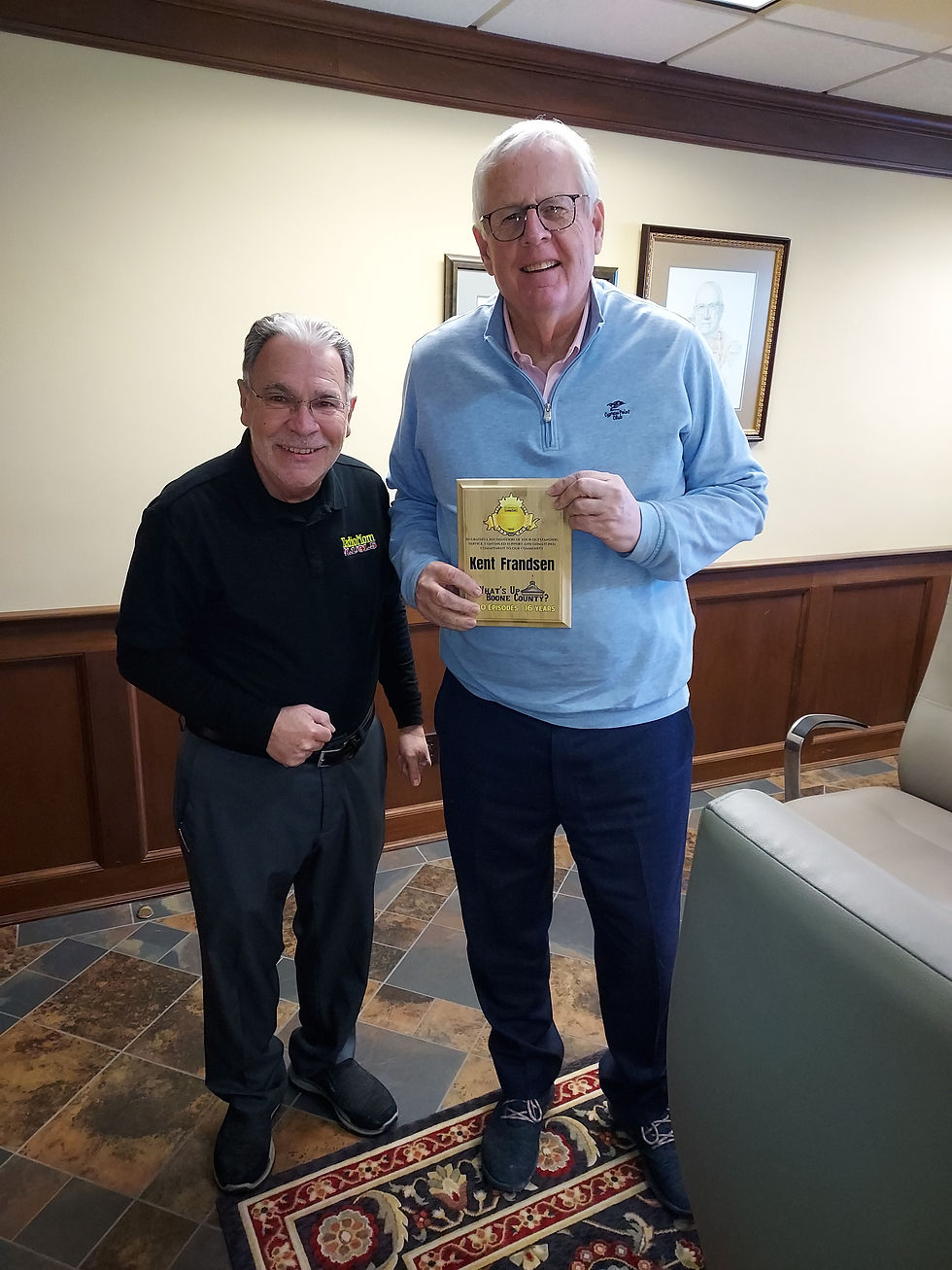 Radio Mom 91.1 91.5 General Manager Phil Thompson present What's Up Boone County host Kent Frandsen with a plaque recognizing Kent's 800th show.