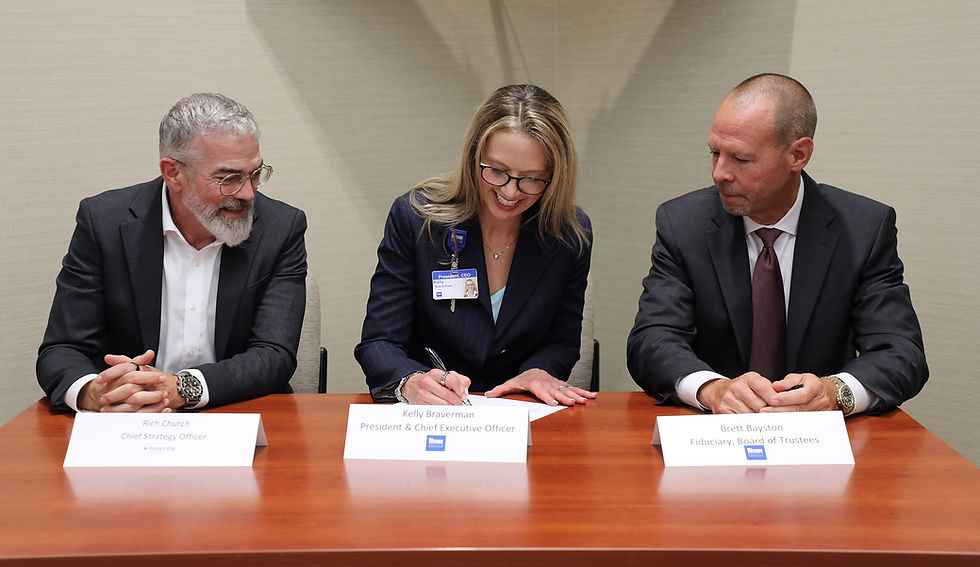 Rich Church, Parkview Health Chief Strategy Officer; Kelly Braverman, Witham President and CEO; and Brett Bayston, Witham Board of Trustees Fiduciary; sign the Parkview Witham Affiliation Agreement.