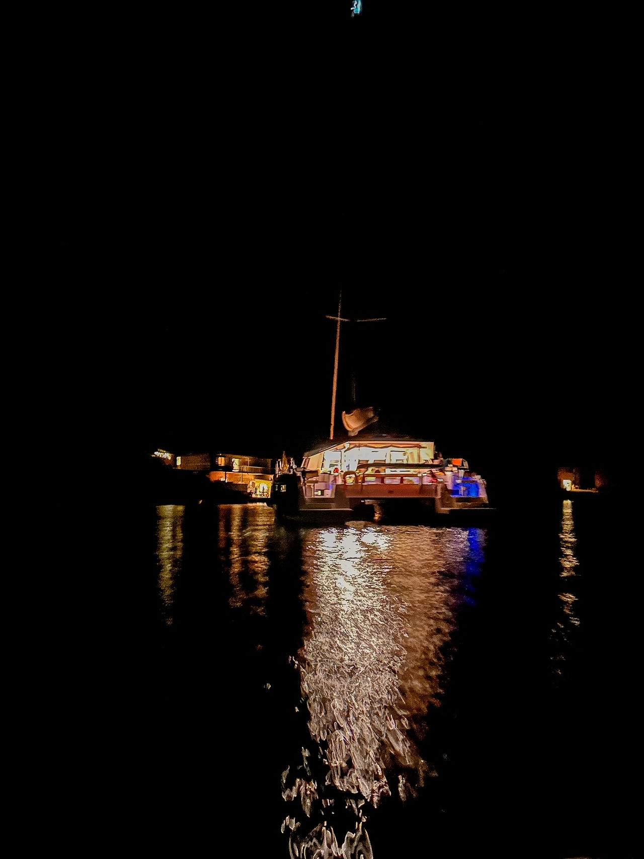 view of catamaran at night in croatia