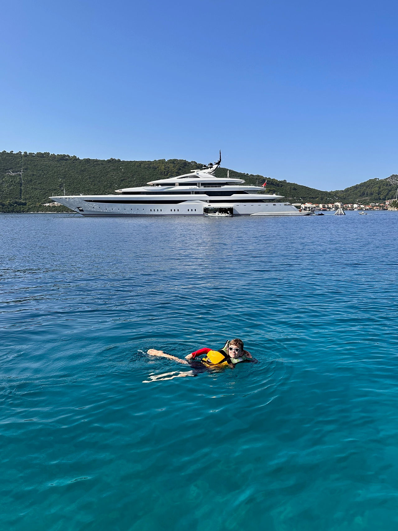 view of mega yacht with boy in croatia