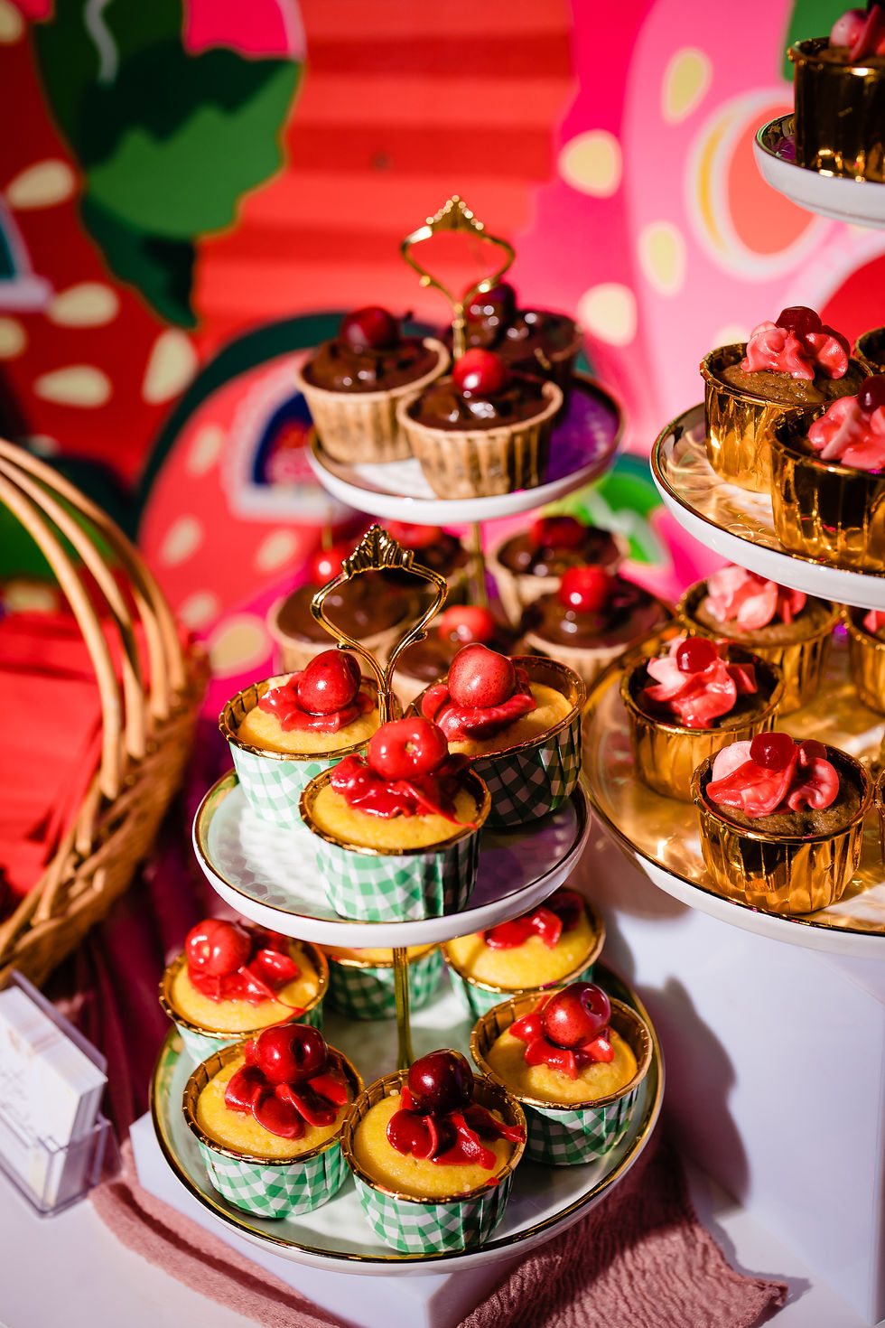 Colorful dessert bar with cherry-topped cupcakes and layered treats at a vibrant bar mitzvah venue in Tampa Bay