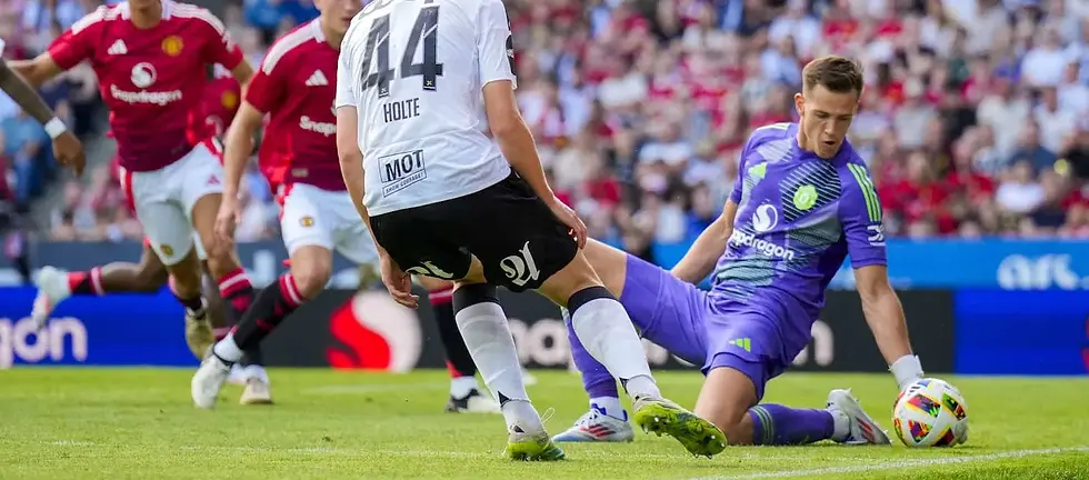 Radek Vítek makes a low save on his Manchester United debut against Rosenborg.