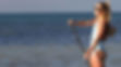 Person paddle boarding on the ocean at Grassy Flats resort in Marathon, Florida.