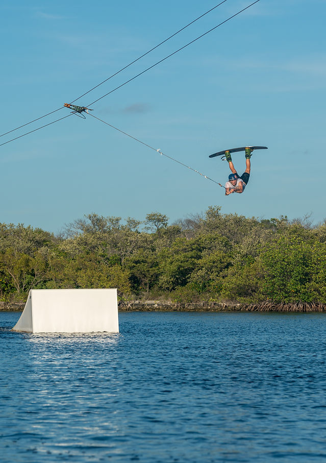 A person jumping over a ramp on a wakeboard in Marathon, Florida.
