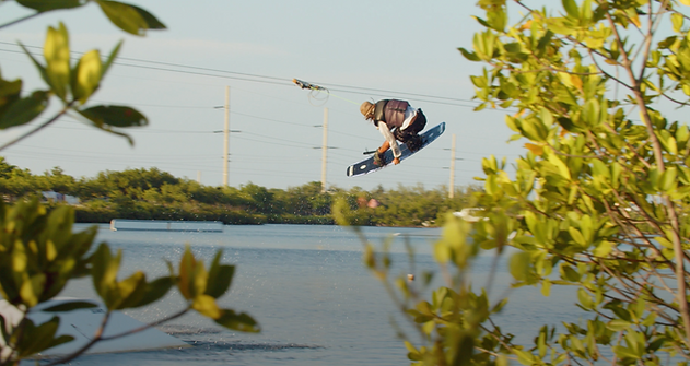 Person jumping on a wakeboard.