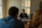 Personal Injury Lawyer Taylor Burnham discussing car insurance policy with this clients