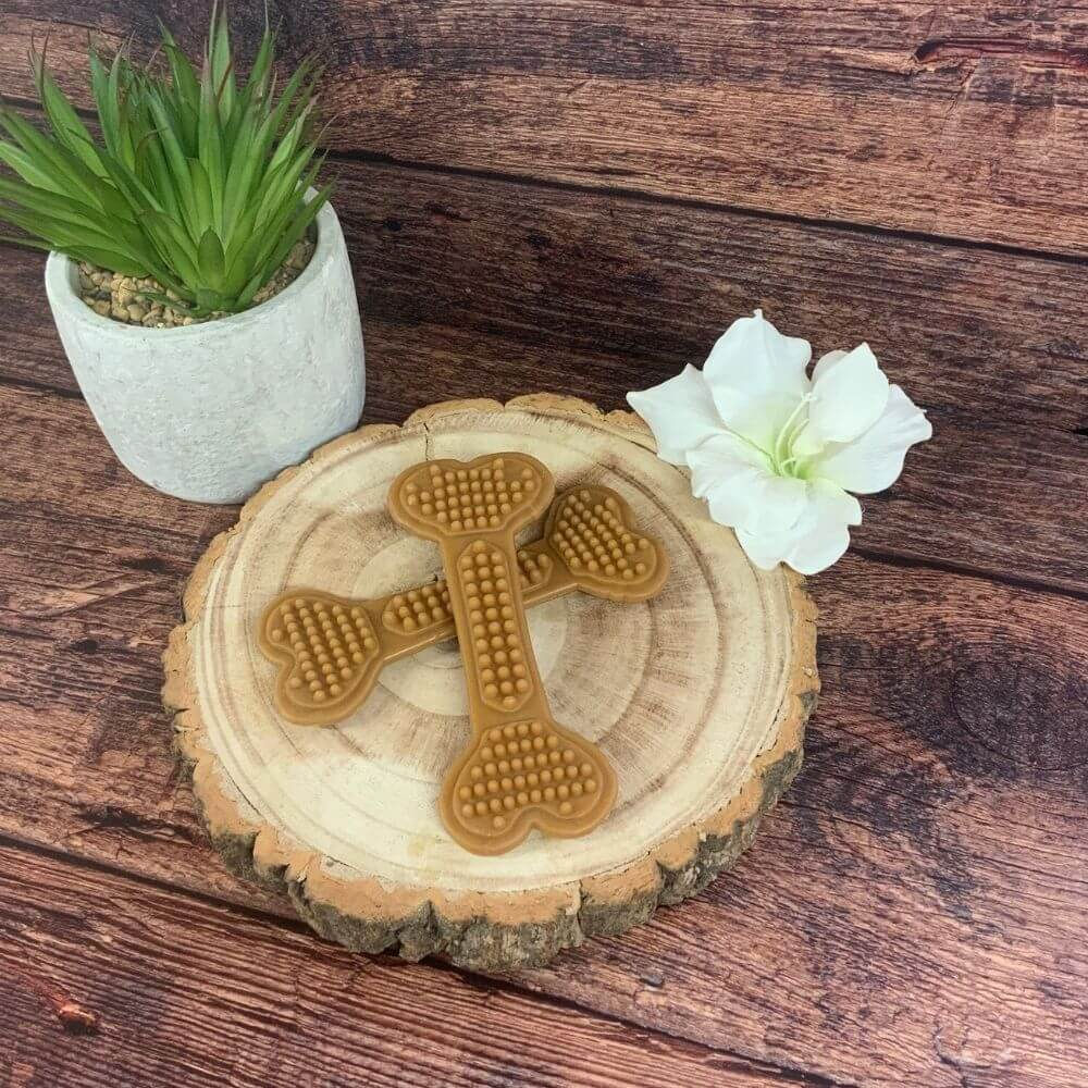 BumpiBones vegan dog treats on wooden board – bone-shaped chews with peanut butter and banana