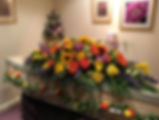 Colourful casket spray