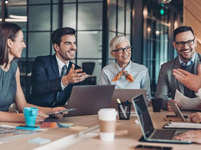 A group of businesspeople working together on a team.