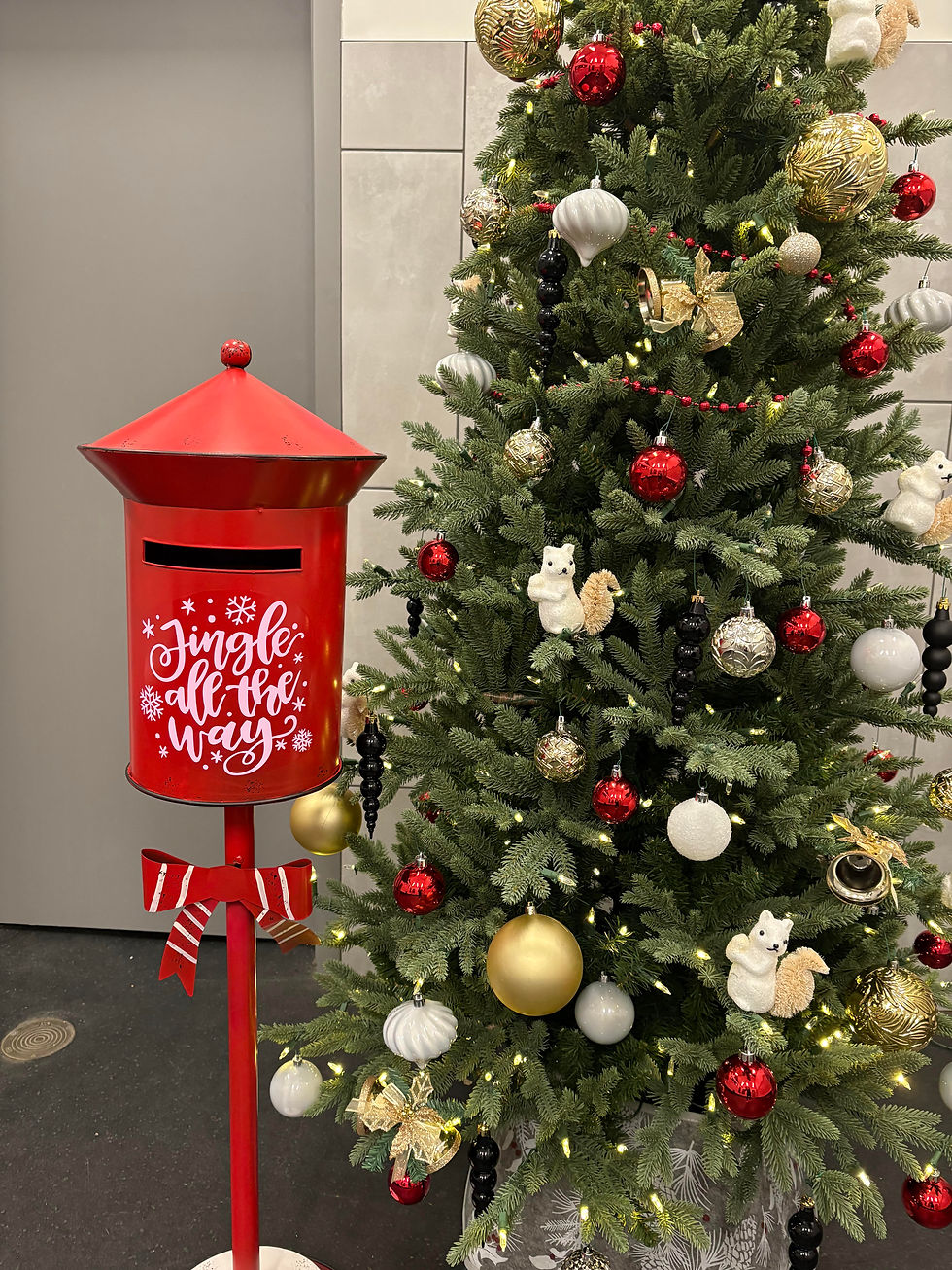 A bright red Santa mailbox is displayed at the Leisure Centre. A notice explains that the Letters to Santa box is now open for submissions. Residents can drop off their letters anytime before the deadline of December 4, 2025. Instructions note that no stamp is required, a return address should be included, and letters should be addressed to Santa Claus at the North Pole, H0H 0H0, Canada.