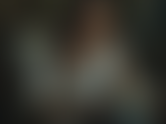 A woman thinking about what to write in her journal.