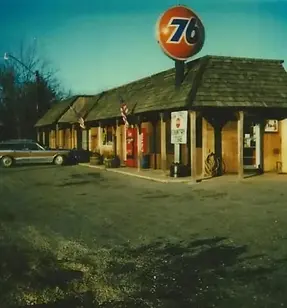 the location when it was a gas station in the 80s, viewed from the far corner of the parking lot.