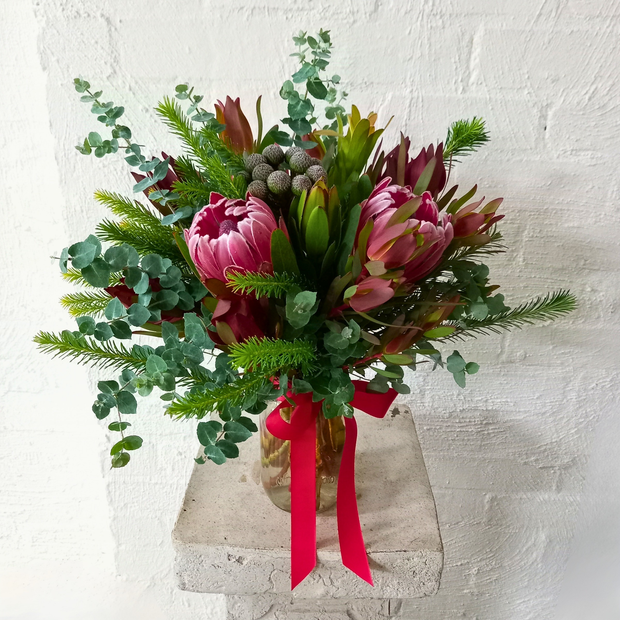 Native Flowers in Glass Vase