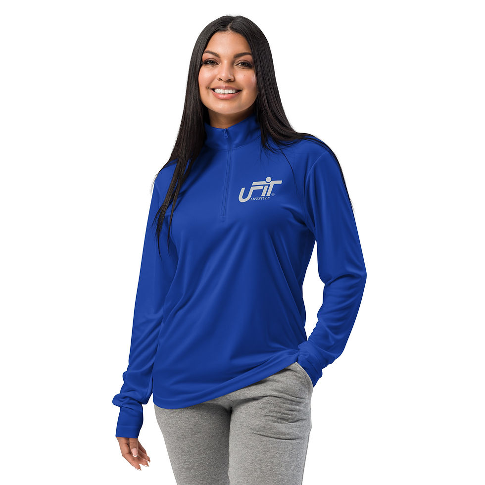 Smiling woman in blue long-sleeved shirt with logo
