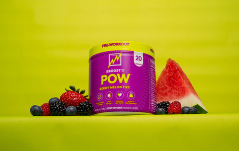 EBoost POW Pre-Workout in Berry Melon Fizz Flavor surrounded by actual blue berries, black berries, strawberries, and watermelon.