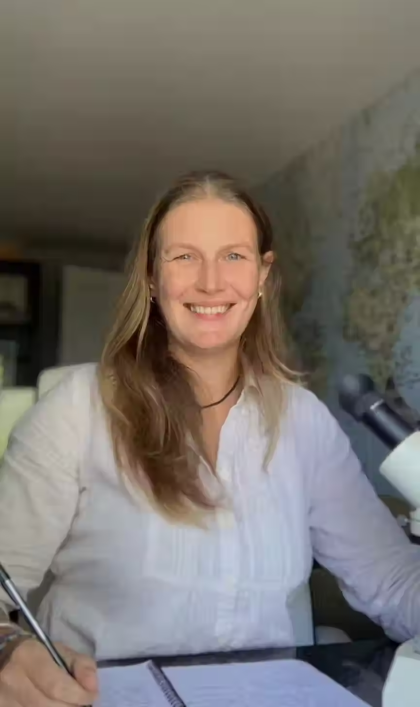 smiling woman wearing white shirt - Dr. Maggie Gill