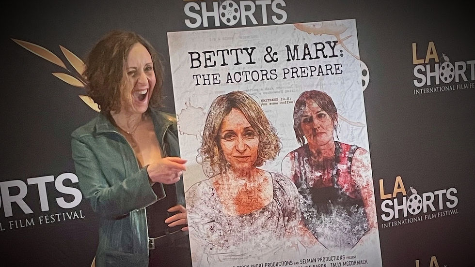 Dana Lyn Baron on the red carpet with the film poster for Betty & Mary: The Actors Prepare