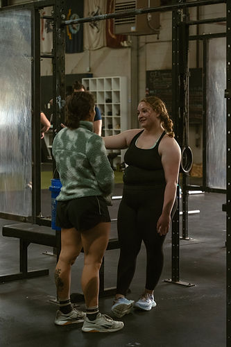 Carolina CrossFit owner speaking with a member