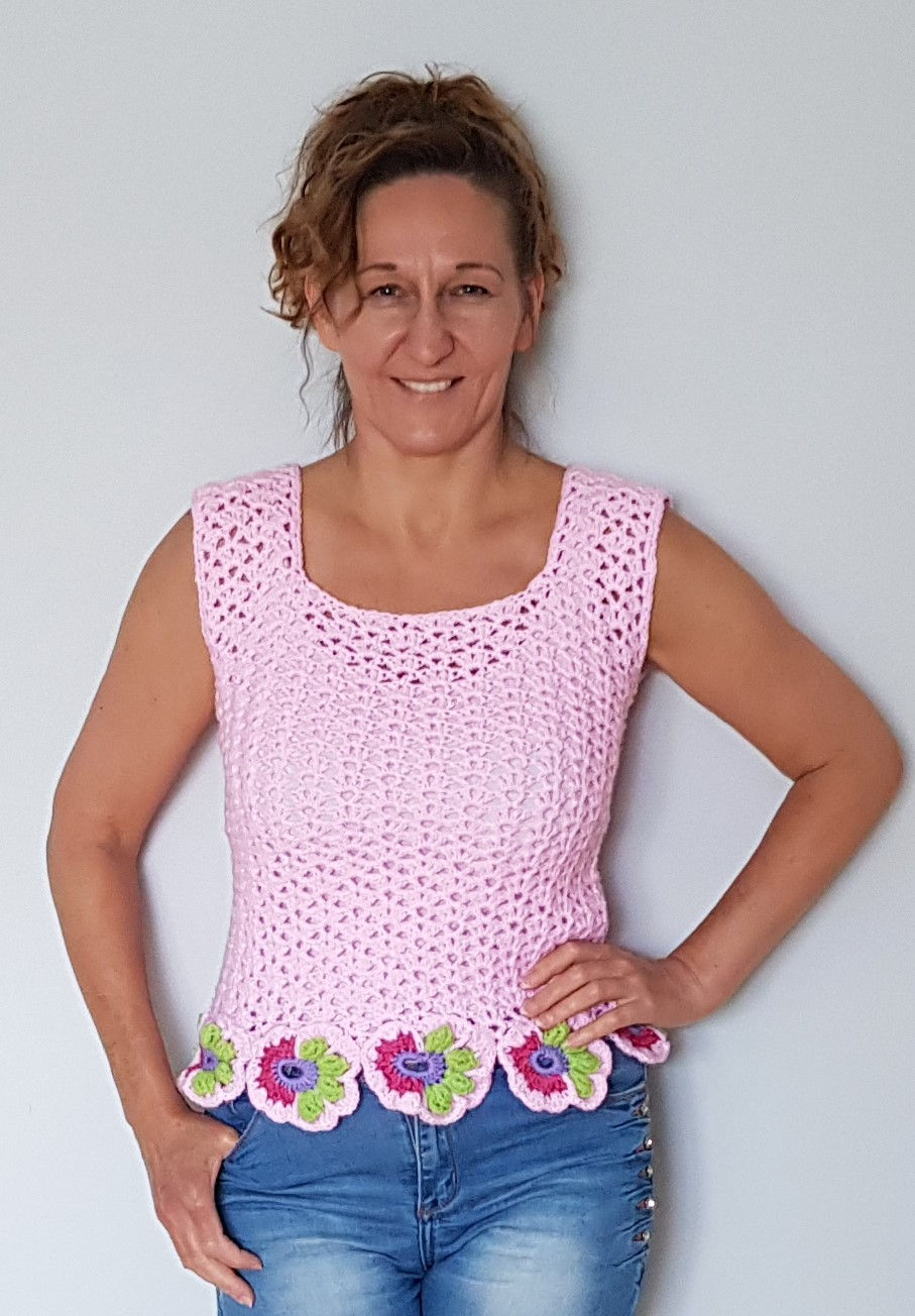 Hand crocheted pink summer top with asymmetrical flowers