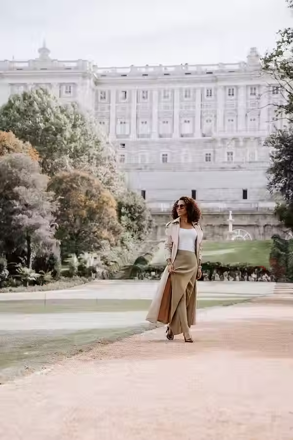 A female photoshoot in the gardens of Campo del Moro in Madrid, overlooking the facade of the Royal Palace.