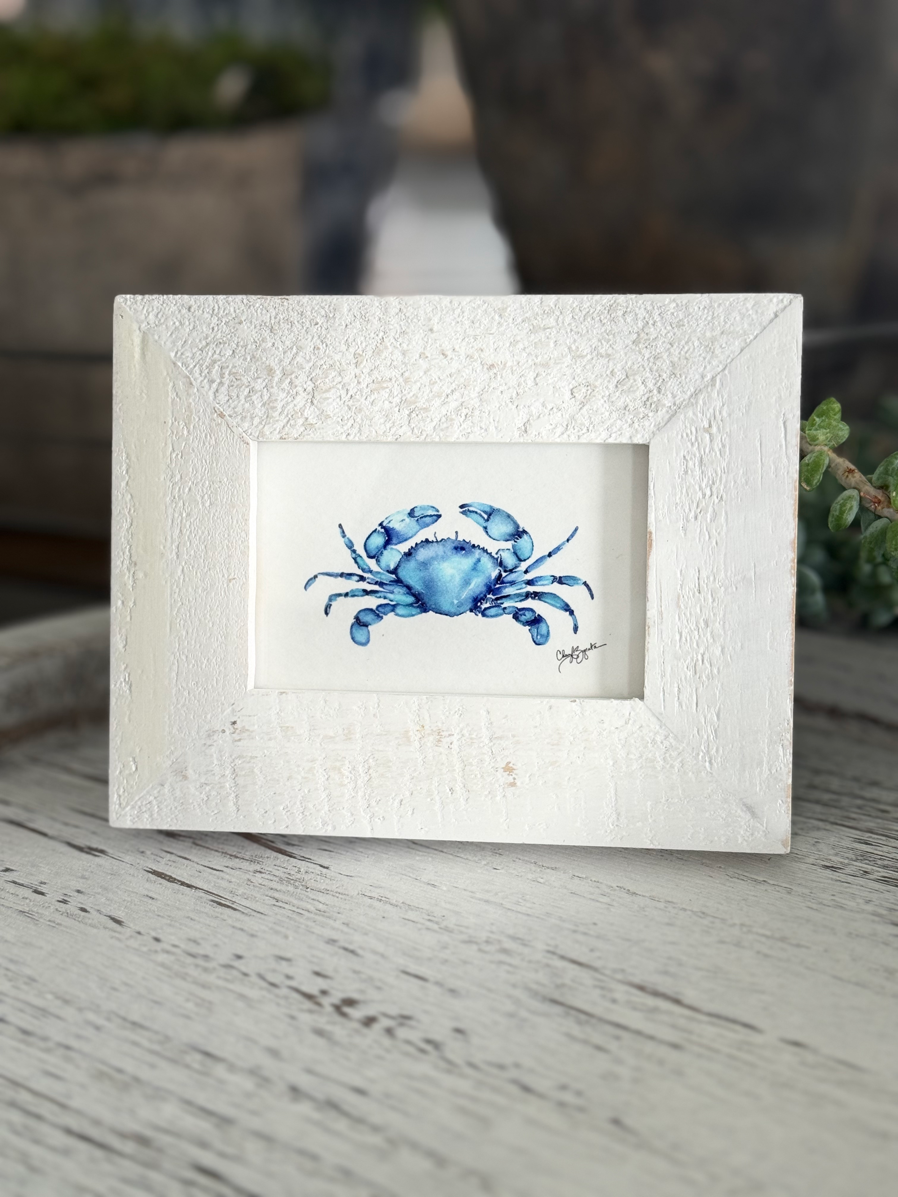 Blue crab watercolor painting in white frame