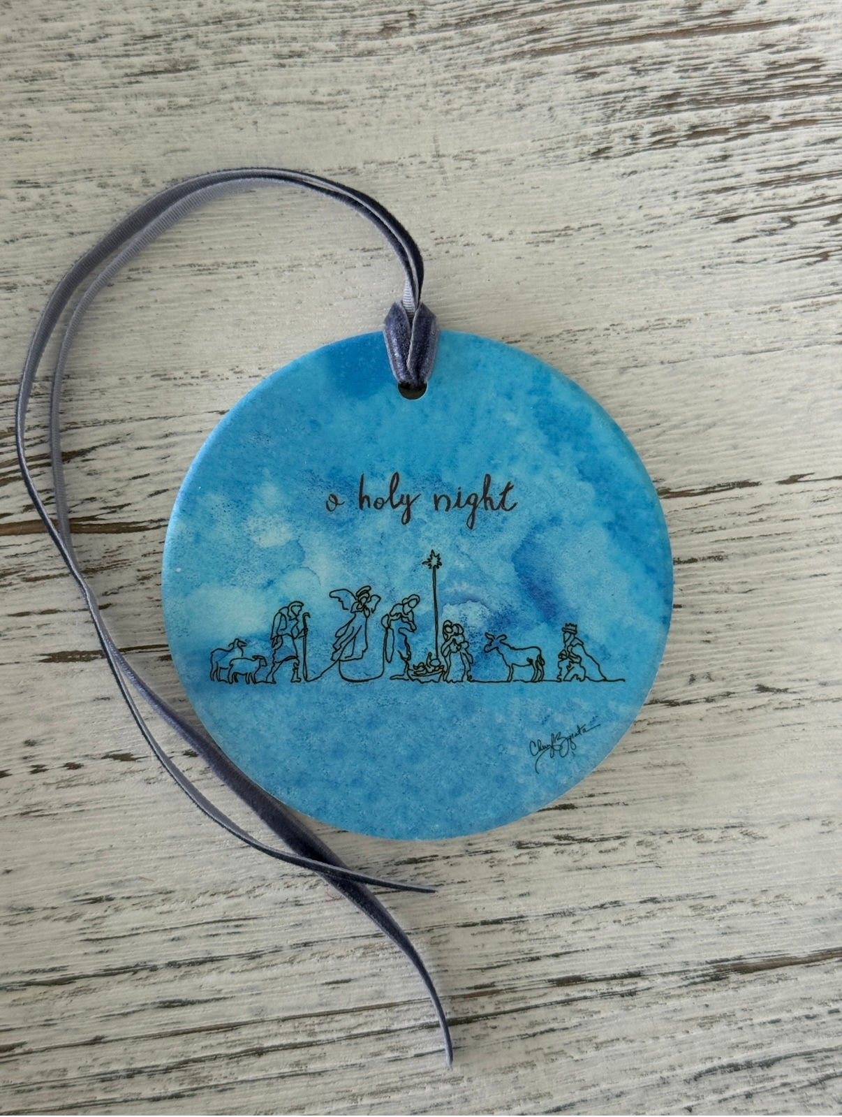 Round blue ornament: 'Holy Night'