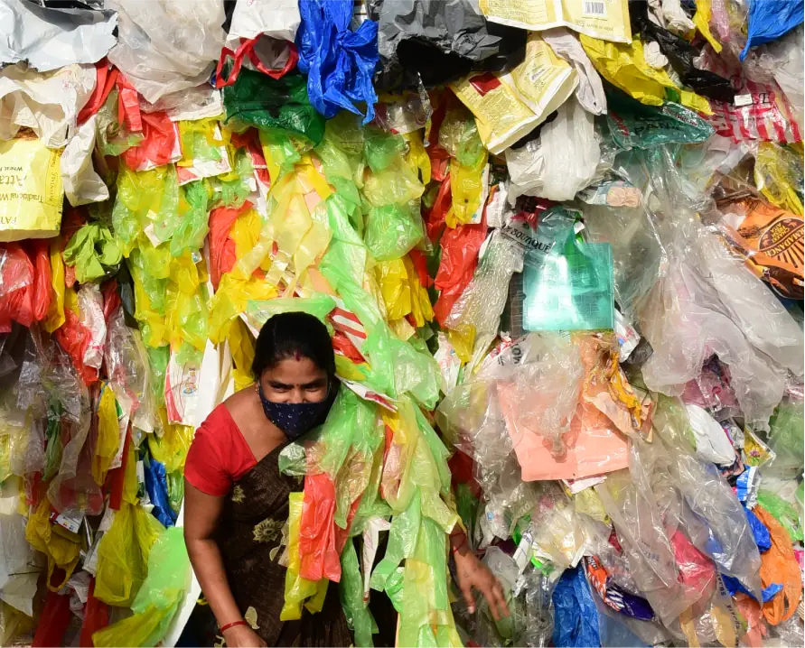 women collecting plastic waste