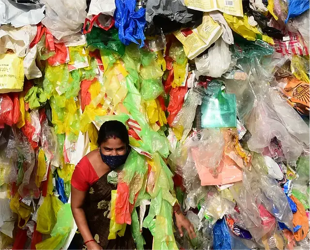 women collecting plastic waste