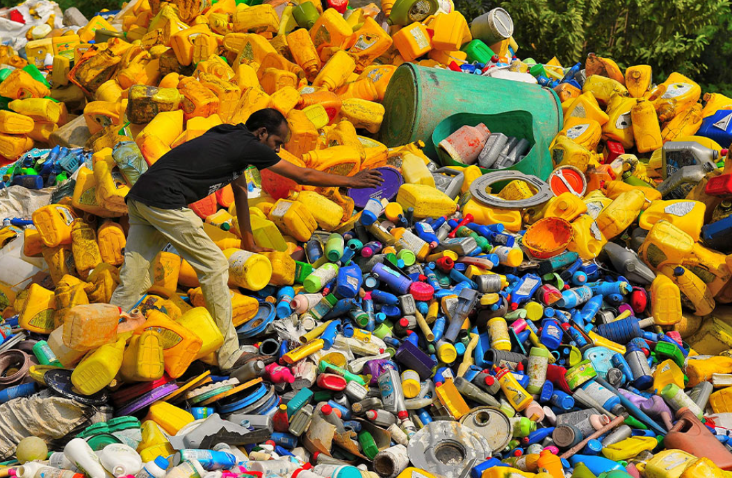 man collecting plastic waste