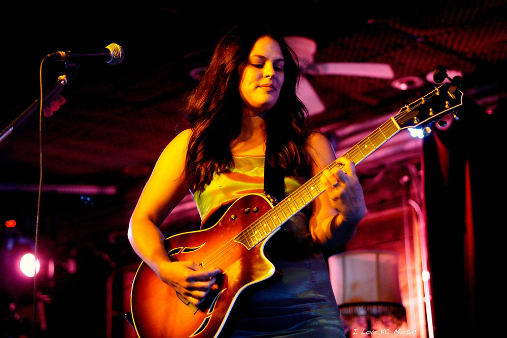 Nicki White playing guitar - Photo by Kimmy DeVries