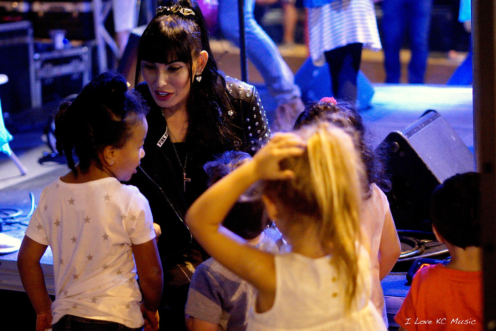 Kianna with adoring fans after the performance the Plaza Art Fair