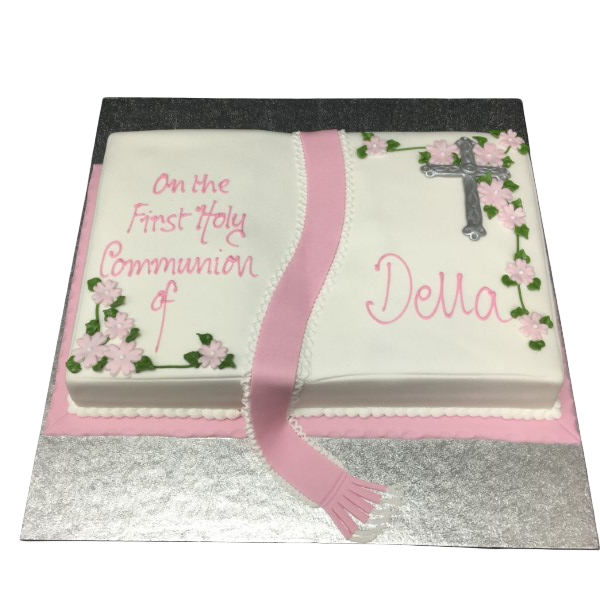 A beautifully decorated Communion book cake with intricate detailing perfect for a religious celebration.