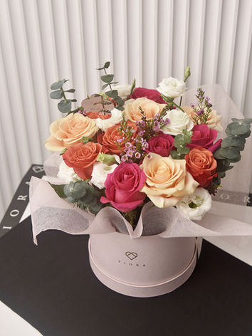 Assorted premium blooms in Fiora Manila flower shop's classic bucket with Happy Mother's Day topper