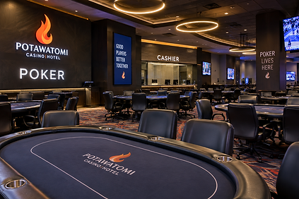 Potawatomi Casino Hotel poker room in Milwaukee with modern poker tables, black chairs, illuminated ceiling rings, cashier counter, TVs, and Potawatomi signage.