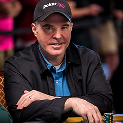 Cary Katz seated at a poker table wearing a black PokerGO cap during a live poker tournament.