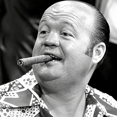 Walter “Puggy” Pearson in a black-and-white close-up portrait with a cigar, wearing a patterned shirt.