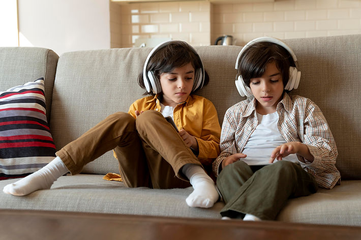 little-twins-playing-their-tablet.jpg