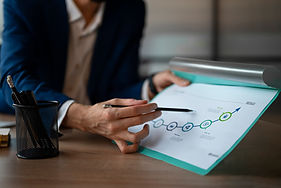 person-office-analyzing-checking-finance-graphs.jpg