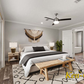 Bedroom with bed, rug, lamps, art, and Ken-Co Homes