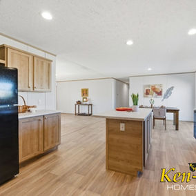 Interior view of a modern kitchen and living space, KenCo Homes.