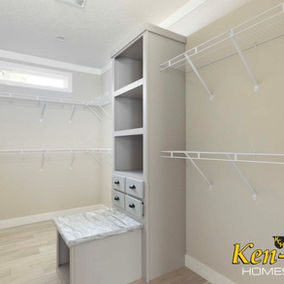 Empty closet with shelves and drawers Ken-Co Homes, white walls, storage space.
