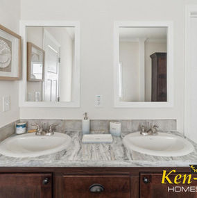 Bathroom with two sinks and mirrors, Ken-Co Homes, white walls, clean design.